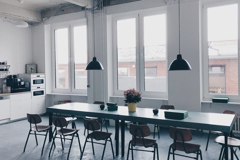 a desk with a chair in a room