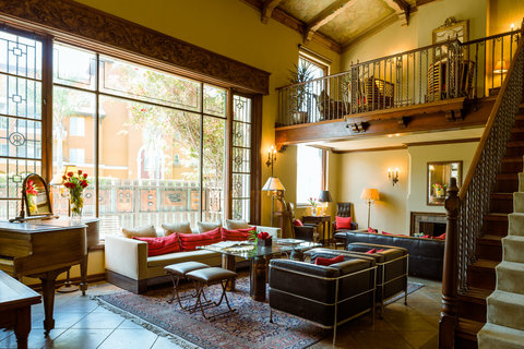 a living room filled with furniture and a large window