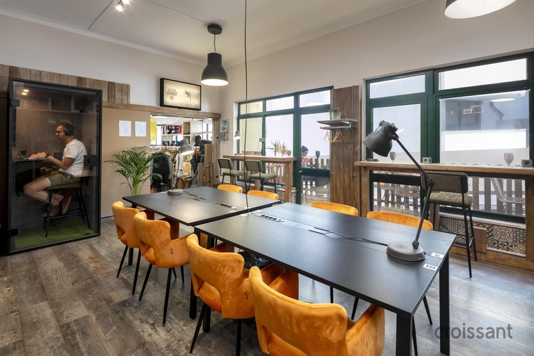 a room filled with furniture and a large window