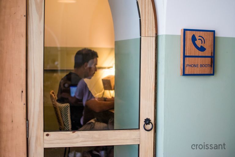 a person sitting in front of a mirror posing for the camera