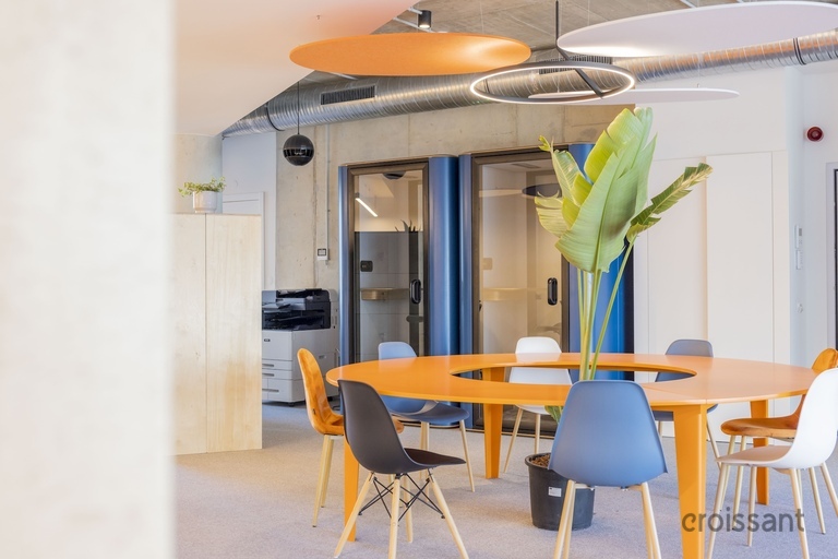 an office with a desk and chair in a room