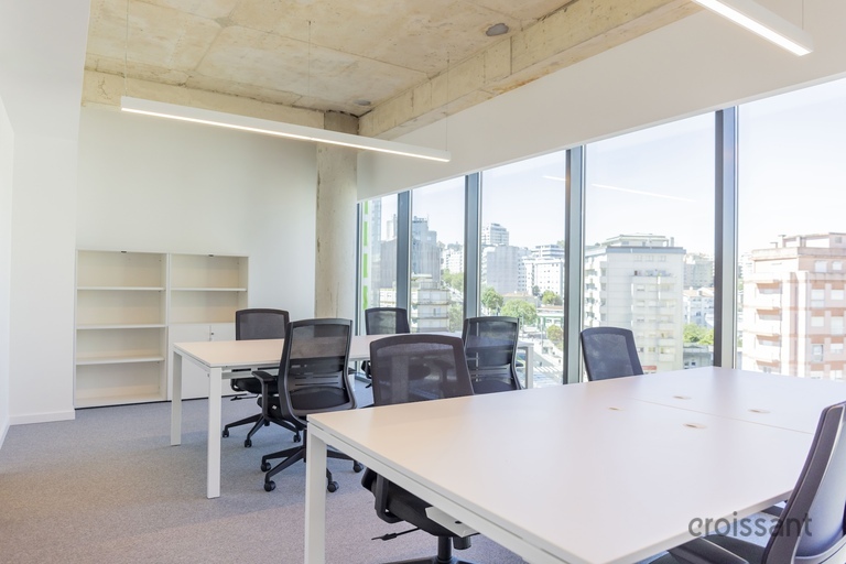 a room filled with furniture and a large window