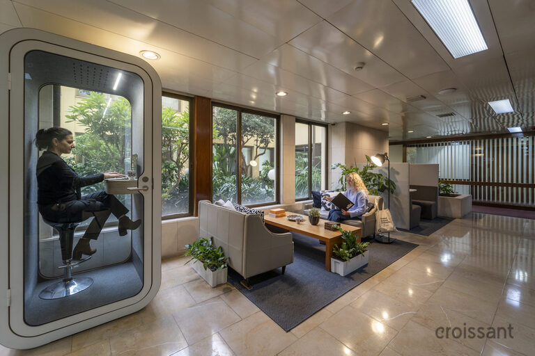 a room filled with furniture and a large window