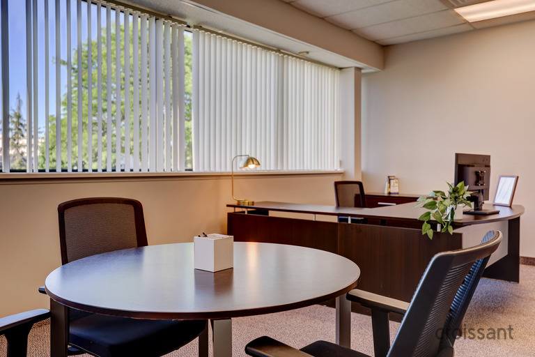 a dining room table in front of a window