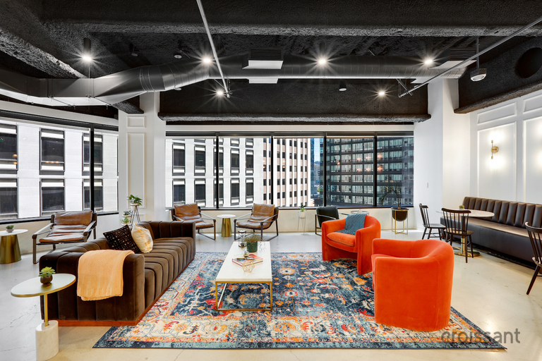 a room filled with furniture and a large window