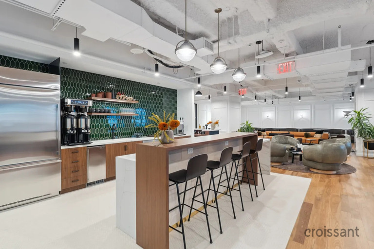 a kitchen with an island in the middle of a room