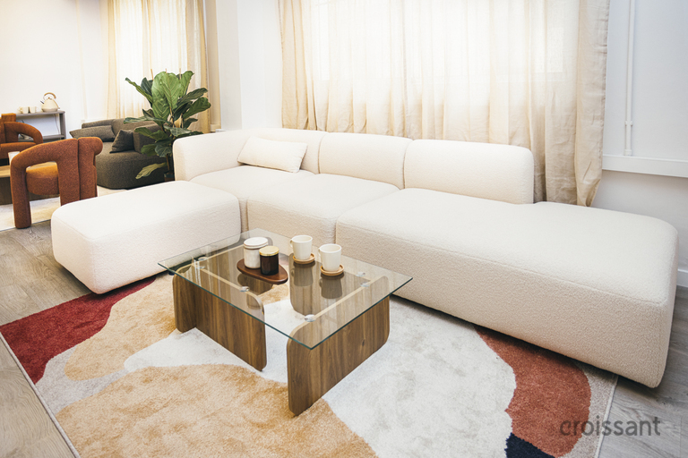 a living room filled with furniture and a flat screen tv