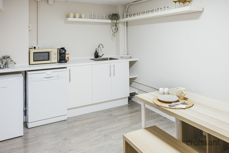 a kitchen with a sink and a mirror