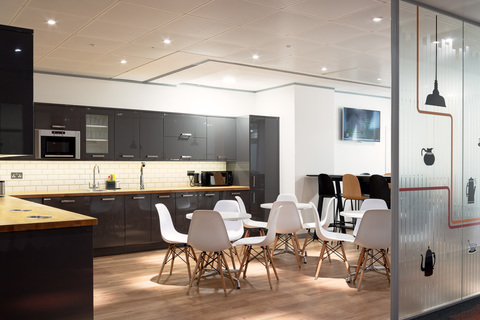 a kitchen with a dining room table