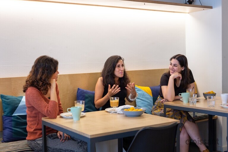 a group of people sitting at a table