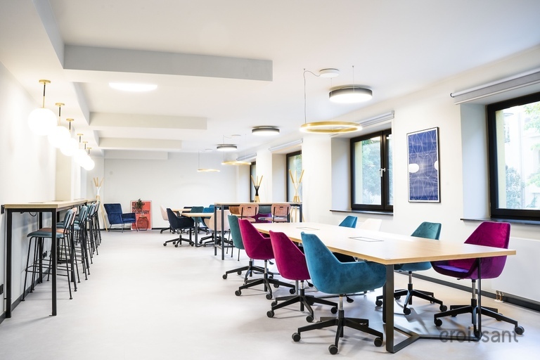 a room filled with furniture and a blue chair