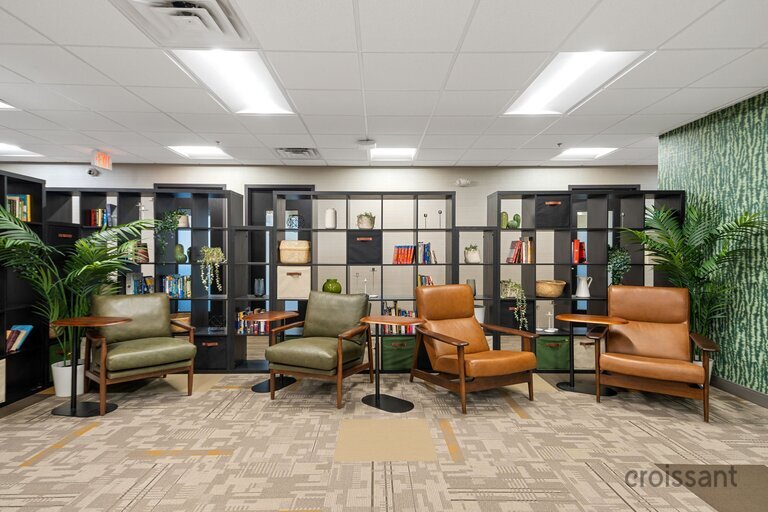 a living room filled with furniture and a table