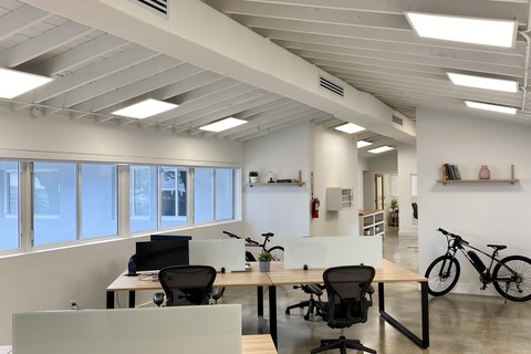 a room filled with furniture and a large window