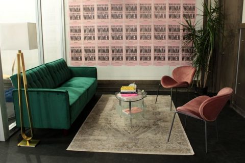 a large red chair in the living room