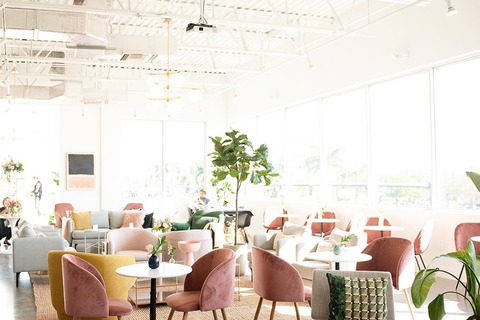 a room filled with furniture and a large window