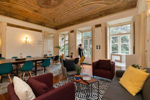 a living room filled with furniture and a large window