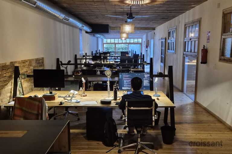 a living room filled with furniture and a large window