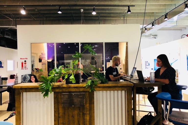 a group of people sitting at a desk
