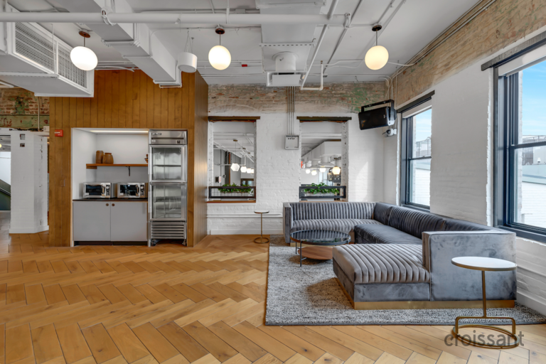 a living room filled with furniture and a large window
