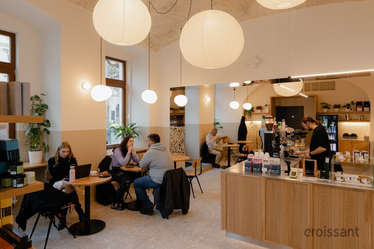 a group of people sitting at a table in a room