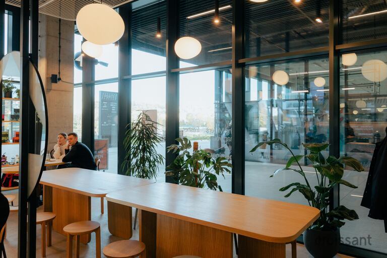a dining room table in front of a window