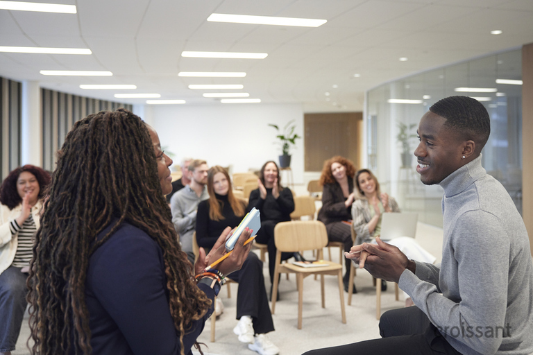 a group of people standing in a room