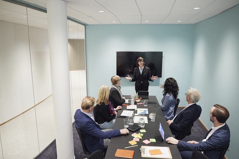 a group of people sitting at a table