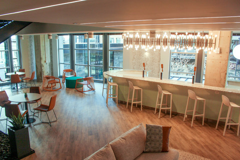 a living room filled with furniture and a large window