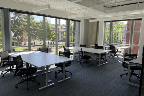 a room filled with furniture and a large window