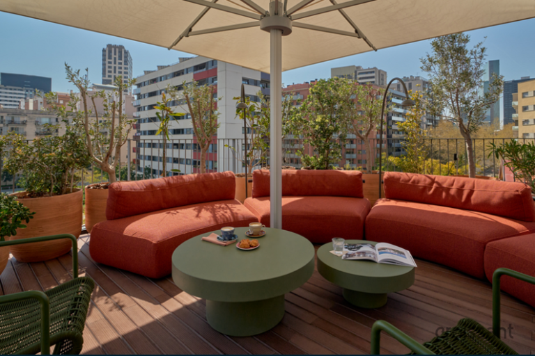 a patio with a table and chairs