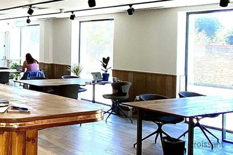 a room filled with furniture and a large window