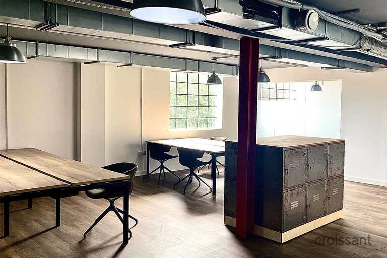 a desk with a chair in a room