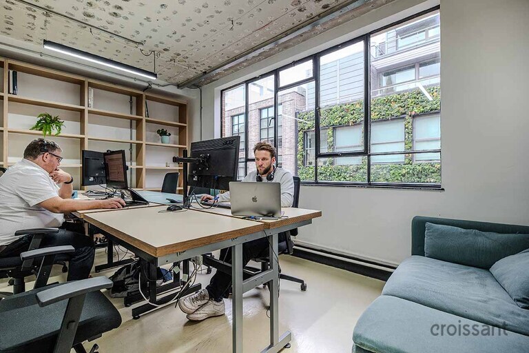 a person sitting at a desk in a room