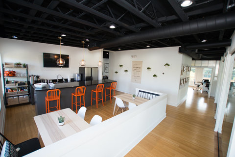 a room filled with furniture and a wood floor