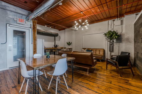 a room filled with furniture and a fireplace