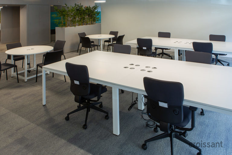 an office with a desk and chair in a room