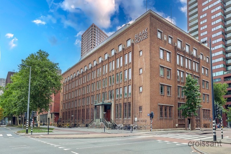 a tall building in the middle of the street