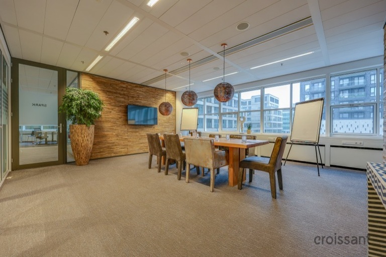 a room filled with furniture on top of a wooden floor