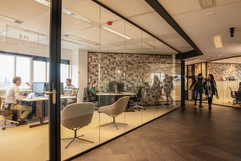 a room filled with furniture and a large window
