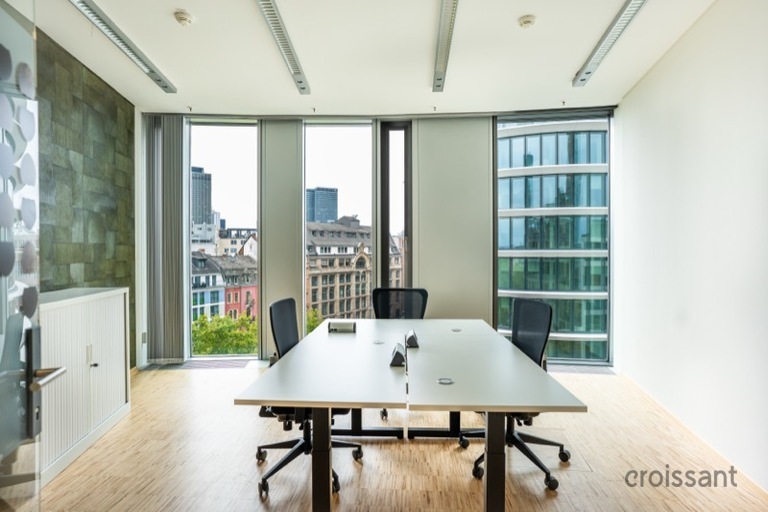 a room filled with furniture and a large window