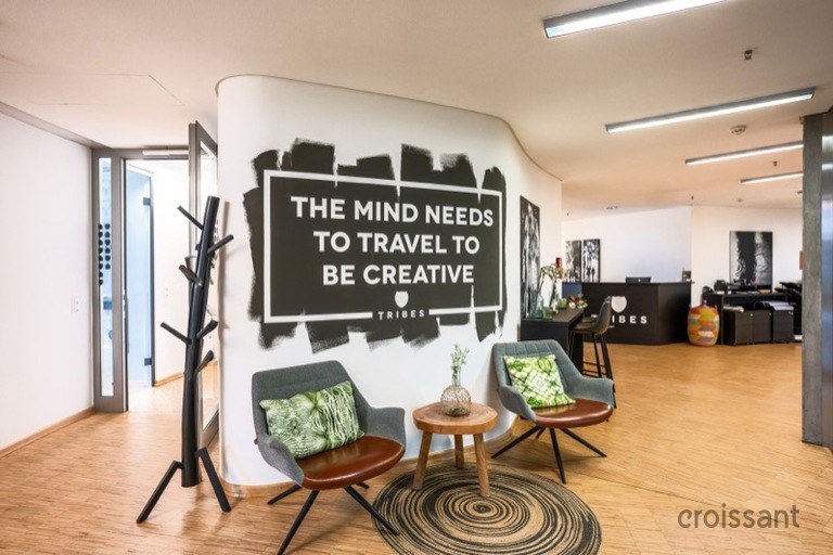 a living room filled with furniture and a table