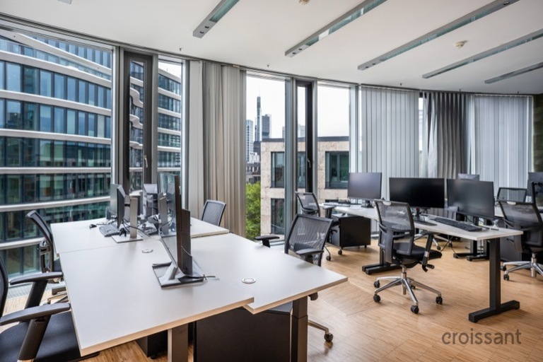 a room filled with furniture and a large window