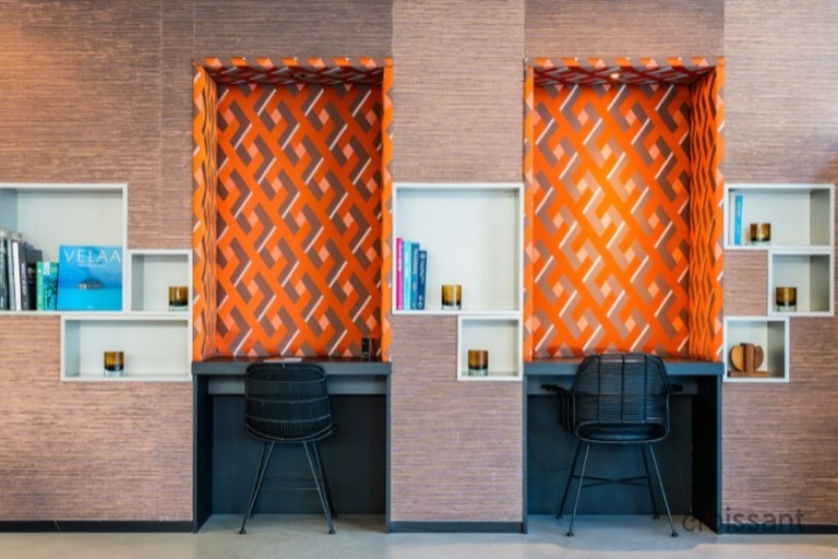 a chair sitting in front of a building