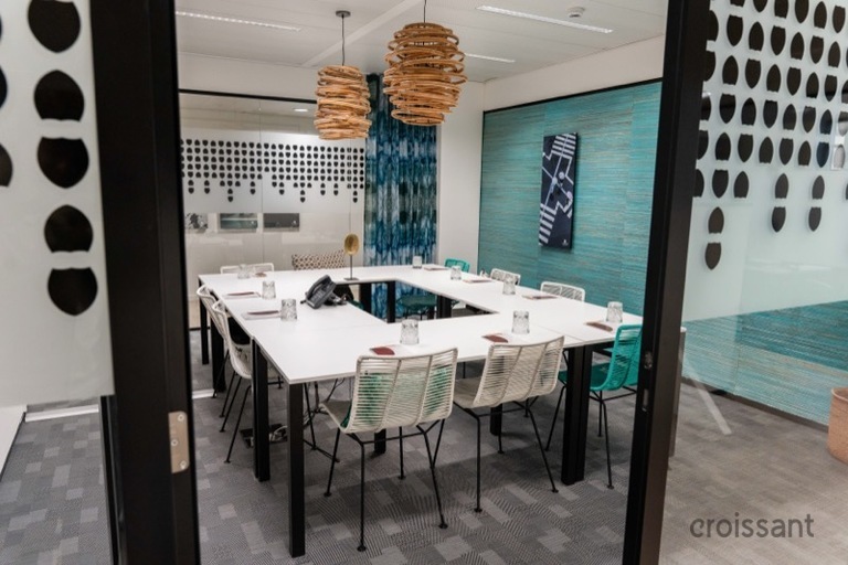 a desk with a chair in a room