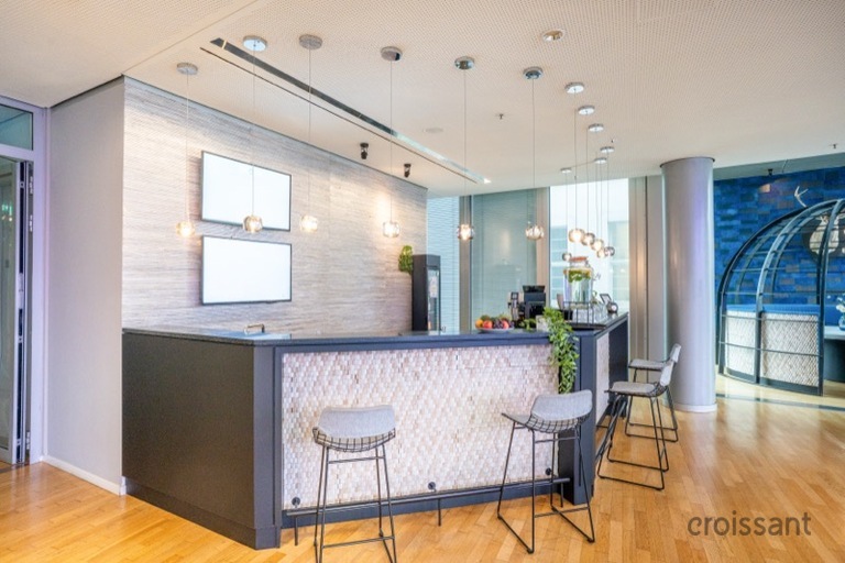 a living room filled with furniture on top of a hard wood floor
