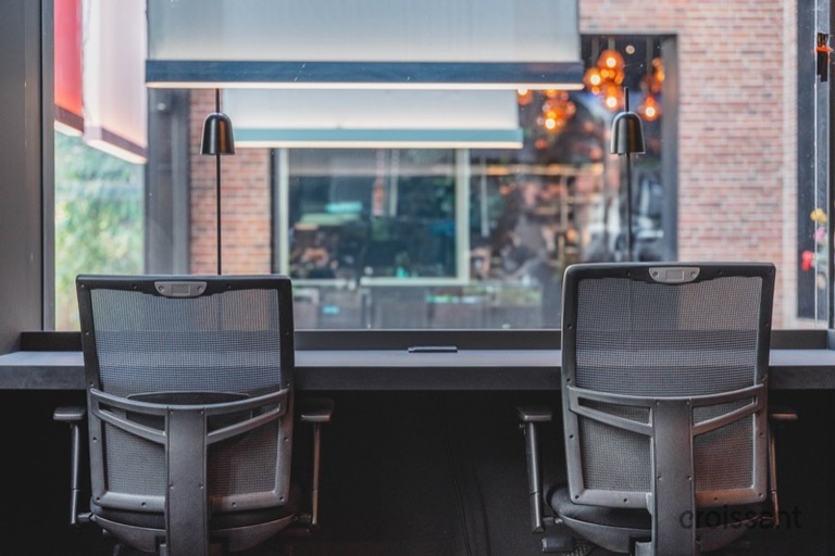 a chair sitting in front of a window