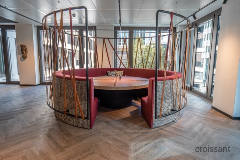 a room filled with furniture and a large window