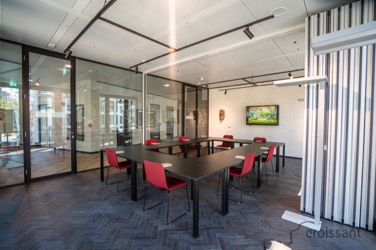 a large room with tables and chairs