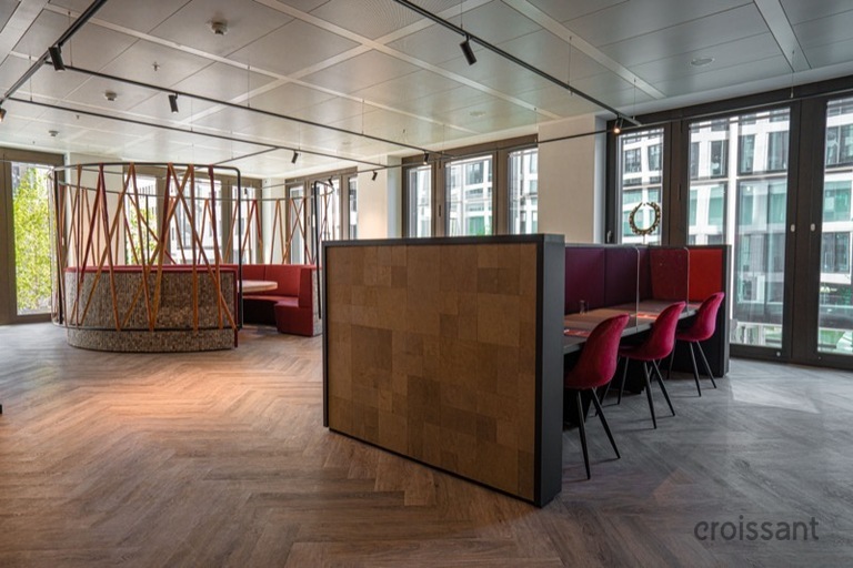 a living room filled with furniture and a large window