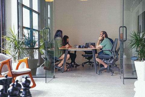 a group of people sitting in a chair in a room